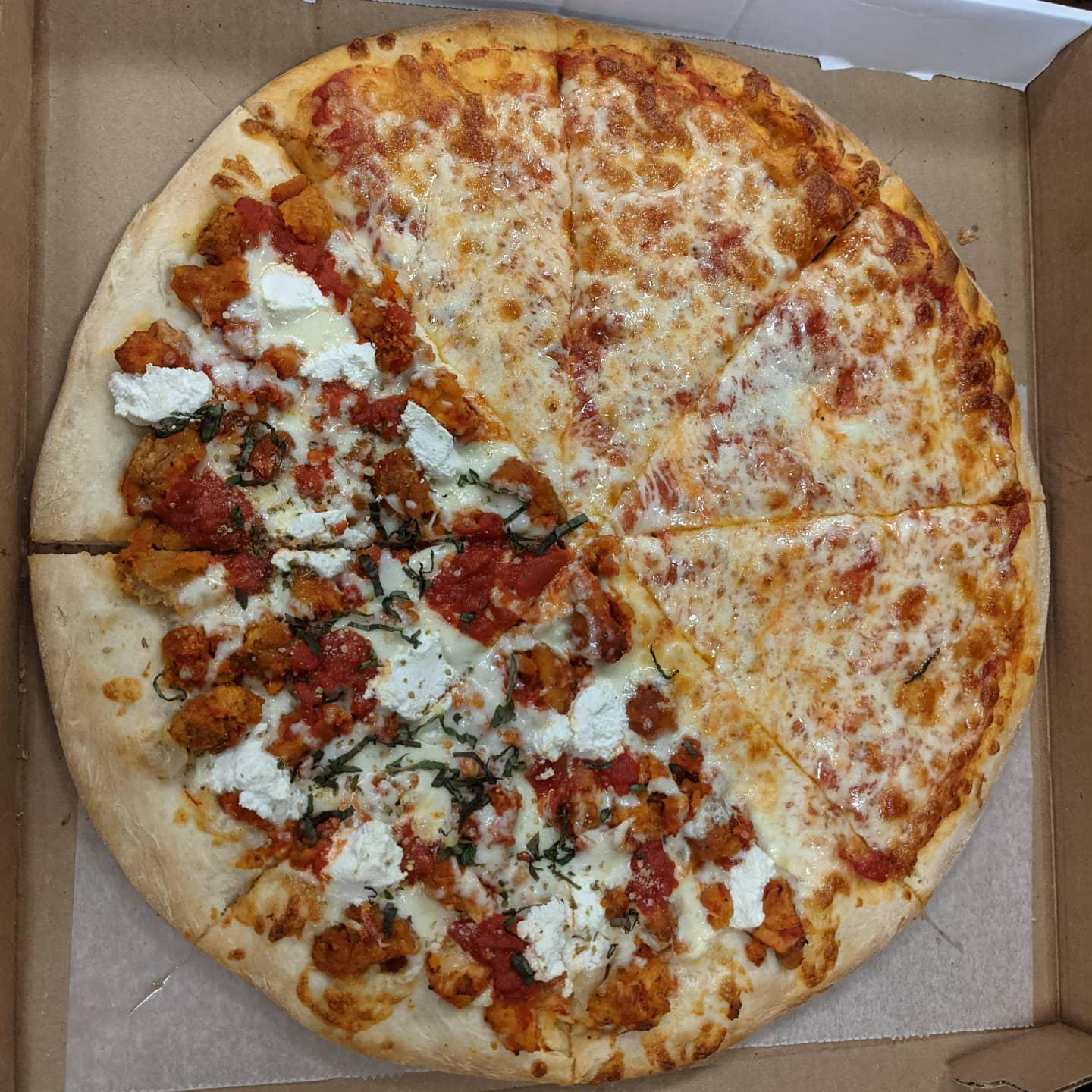 Another look at a half Chicken Parm half cheese pizza from #goldengrainpizza